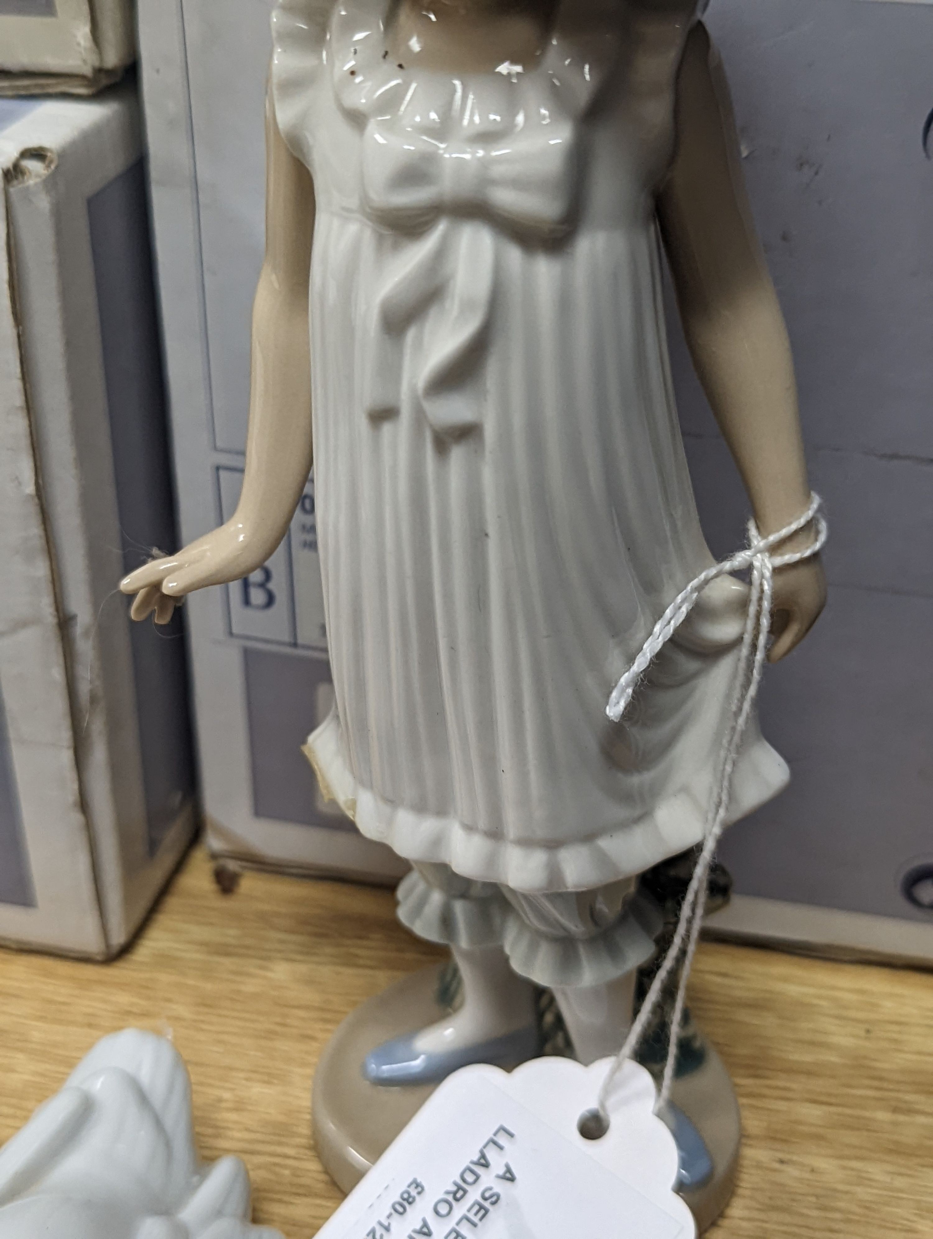 A selection of Lladro and Nao figures